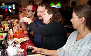 Friends toasting at the Takamatsu sushi bar